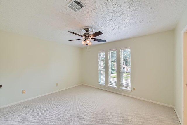 20746 Prince Creek Dr, Katy, TX 77450 - empty room with light colored carpet, a textured ceiling, and a ceiling fan