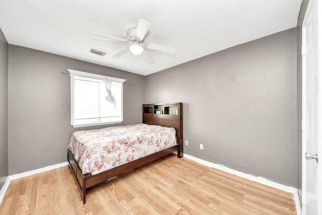 16227 Affirmed Way, Friendswood, TX 77546 - bedroom with light wood finished floors and a ceiling fan