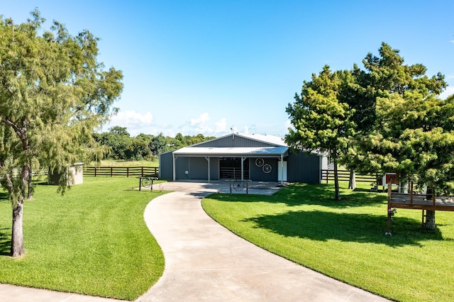 4821 Lawrence Rd, Baytown, TX 77523 - view of property's community with concrete driveway and an exterior structure