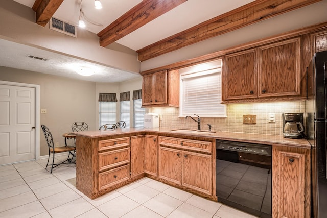 4821 Lawrence Rd, Baytown, TX 77523 - kitchen with dishwasher, a peninsula, beam ceiling, light tile patterned floors, and decorative backsplash