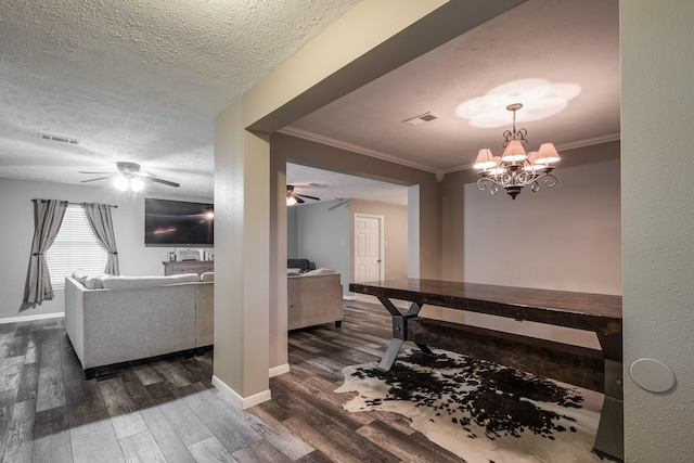 4821 Lawrence Rd, Baytown, TX 77523 - hall featuring dark wood-style floors, ornamental molding, a textured ceiling, and a chandelier