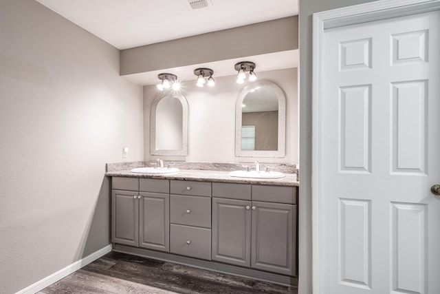4821 Lawrence Rd, Baytown, TX 77523 - bathroom featuring double vanity and wood finished floors