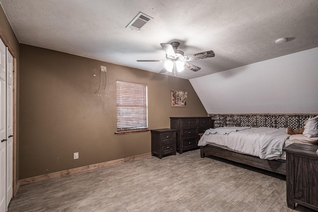 4821 Lawrence Rd, Baytown, TX 77523 - bedroom featuring a textured ceiling and ceiling fan