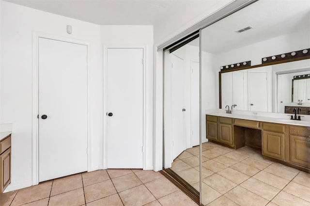4719 Silver Frost Dr, Houston, TX 77066 - full bathroom featuring double vanity, tile patterned flooring, and a closet