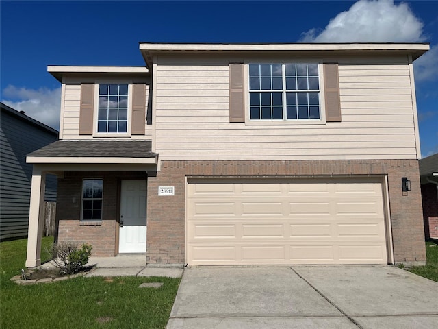 28911 W Pecos River Ct, Spring, TX 77386 - view of front of property featuring a garage, concrete driveway, and brick siding