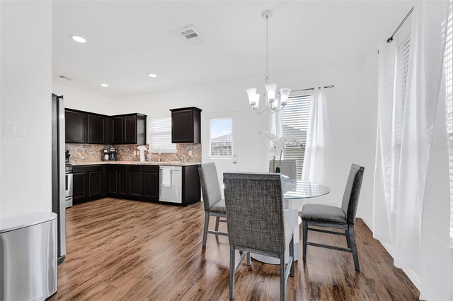 1611 Jaquima Valley Way, Houston, TX 77049 - dining area featuring a chandelier, light wood-type flooring, and recessed lighting