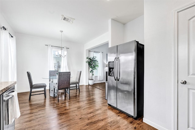 1611 Jaquima Valley Way, Houston, TX 77049 - kitchen with stainless steel appliances, a chandelier, dark wood-type flooring, and hanging light fixtures