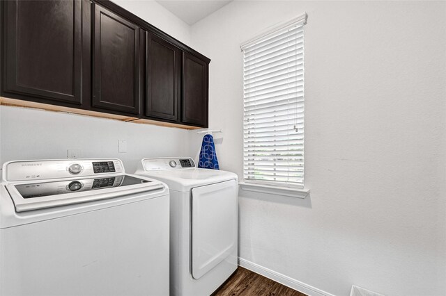 1611 Jaquima Valley Way, Houston, TX 77049 - laundry area with washer and dryer, cabinet space, and dark wood finished floors