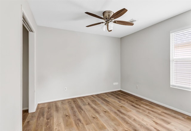 5019 Packard Elm Ct, Katy, TX 77449 - empty room with healthy amount of natural light, a ceiling fan, and light wood finished floors