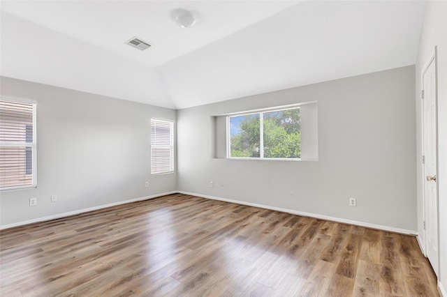 5019 Packard Elm Ct, Katy, TX 77449 - empty room with lofted ceiling and wood finished floors