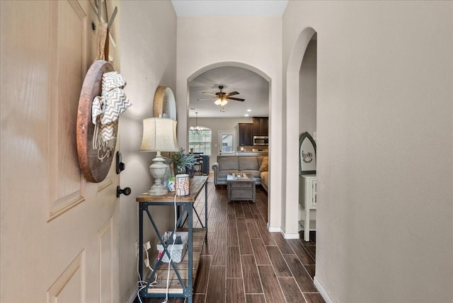 13203 Adolpho Dr, Houston, TX 77044 - entryway featuring ceiling fan, arched walkways, and dark wood-style flooring