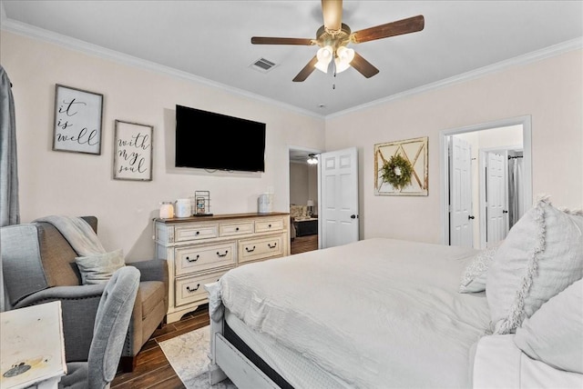 13203 Adolpho Dr, Houston, TX 77044 - bedroom with crown molding, dark wood-style flooring, and a ceiling fan
