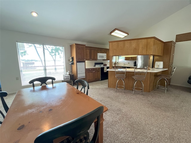 11391 Lakeshore Dr, Thornton, TX 76687 - dining room featuring lofted ceiling and light colored carpet