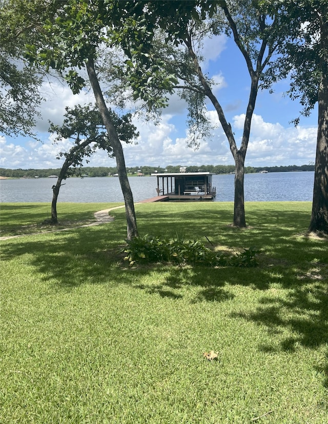 11391 Lakeshore Dr, Thornton, TX 76687 - view of green lawn with a water view and a boat dock