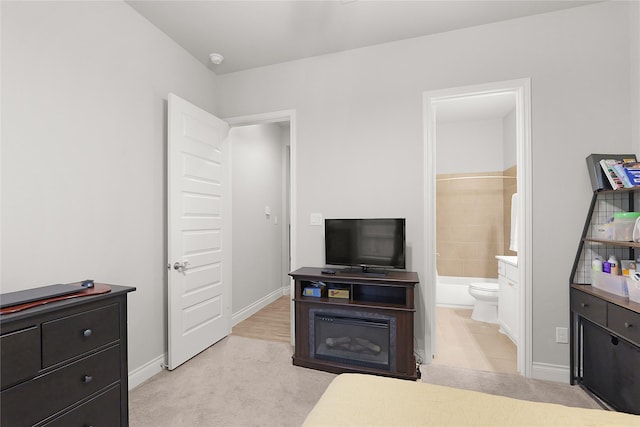 23649 Sage Villa Dr, New Caney, TX 77357 - bedroom with light carpet and connected bathroom