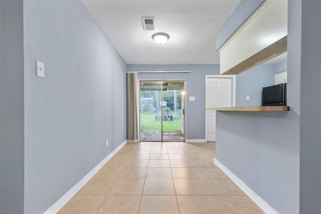 1204 Crescent Blvd, Cleveland, TX 77327 - interior space featuring light tile patterned flooring and baseboards