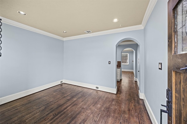 1773 Aden Dr, Houston, TX 77003 - unfurnished room with dark wood-style flooring, arched walkways, recessed lighting, and crown molding