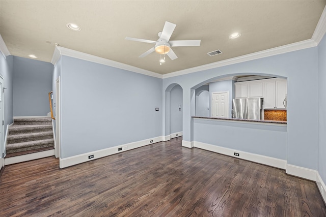 1773 Aden Dr, Houston, TX 77003 - empty room featuring a ceiling fan, crown molding, recessed lighting, dark wood-type flooring, and arched walkways