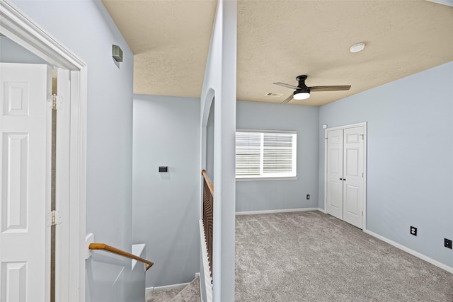 1773 Aden Dr, Houston, TX 77003 - stairs featuring carpet flooring, ceiling fan, and a textured ceiling