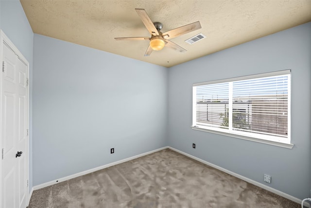 1773 Aden Dr, Houston, TX 77003 - unfurnished room with ceiling fan, carpet, and a textured ceiling