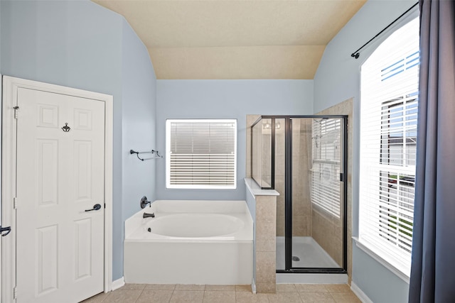 1773 Aden Dr, Houston, TX 77003 - bathroom featuring a garden tub, a stall shower, lofted ceiling, tile patterned flooring, and healthy amount of natural light
