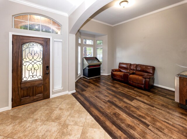 6111 Windsor Chase Ln, League City, TX 77573 - entryway with arched walkways, crown molding, and wood finished floors