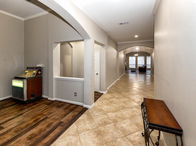 6111 Windsor Chase Ln, League City, TX 77573 - corridor featuring arched walkways, ornamental molding, tile patterned floors, and recessed lighting