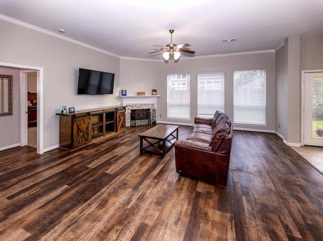 6111 Windsor Chase Ln, League City, TX 77573 - living room with ceiling fan, wood finished floors, crown molding, and a fireplace