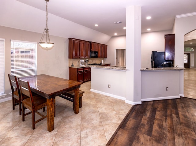 6111 Windsor Chase Ln, League City, TX 77573 - dining space with arched walkways, vaulted ceiling, and recessed lighting