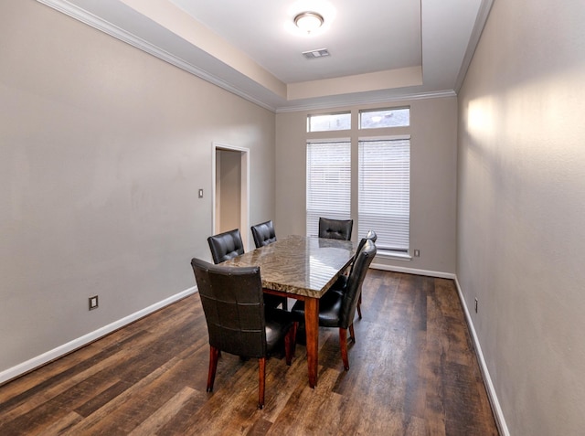 6111 Windsor Chase Ln, League City, TX 77573 - dining space featuring dark wood-type flooring and a tray ceiling