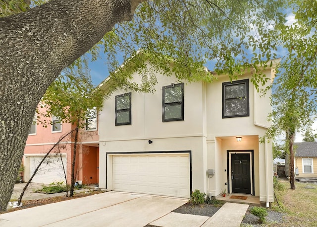 2905 Baer St Unit 6, Houston, TX 77020 - townhome / multi-family property featuring stucco siding, a garage, and concrete driveway