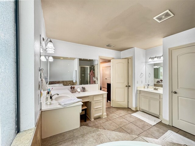 2905 Baer St Unit 6, Houston, TX 77020 - full bathroom featuring two vanities, tile patterned flooring, and a stall shower