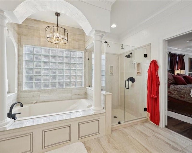 2700 Spurlock Rd, Nederland, TX 77627 - bathroom featuring decorative columns, a stall shower, a garden tub, crown molding, and a chandelier
