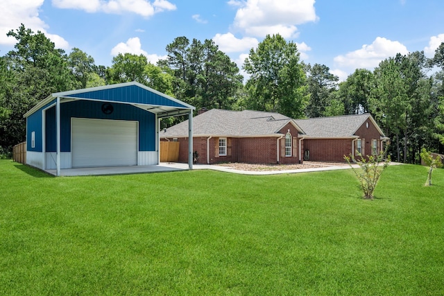 4920 Fm 350 N, Livingston, TX 77351 - view of front facade with a garage, a front yard, an outdoor structure, and brick siding