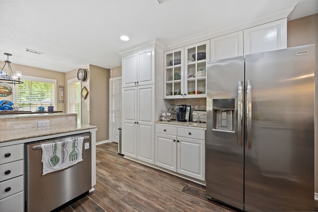 4920 Fm 350 N, Livingston, TX 77351 - kitchen with appliances with stainless steel finishes, white cabinetry, glass insert cabinets, dark wood-style flooring, and a chandelier