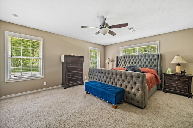 4920 Fm 350 N, Livingston, TX 77351 - carpeted bedroom featuring baseboards and a ceiling fan