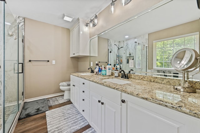 4920 Fm 350 N, Livingston, TX 77351 - full bathroom featuring double vanity, a marble finish shower, and wood finished floors