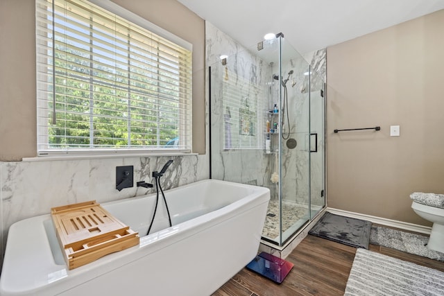 4920 Fm 350 N, Livingston, TX 77351 - full bathroom featuring a freestanding tub, wood finished floors, and a marble finish shower