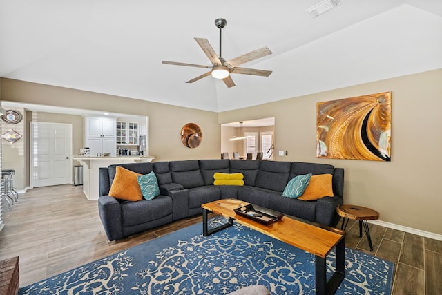4920 Fm 350 N, Livingston, TX 77351 - living room with light wood finished floors, lofted ceiling, and a ceiling fan