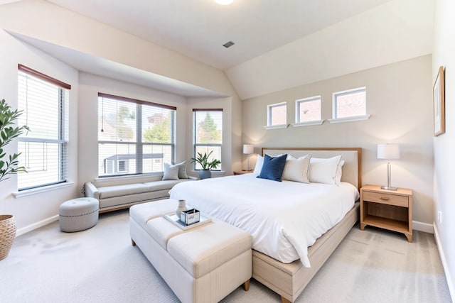 5002 Sawmill Terrace Ln, Spring, TX 77389 - bedroom with light carpet, multiple windows, and lofted ceiling