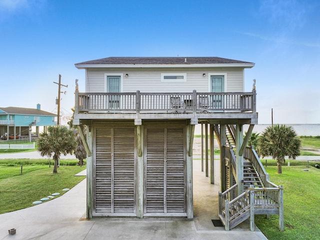 1031 Rollover 2, Gilchrist, TX 77617 - back of property featuring stairs, a yard, and a wooden deck