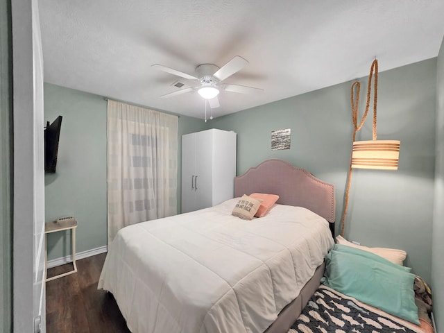 1031 Rollover 2, Gilchrist, TX 77617 - bedroom featuring dark wood finished floors and a ceiling fan