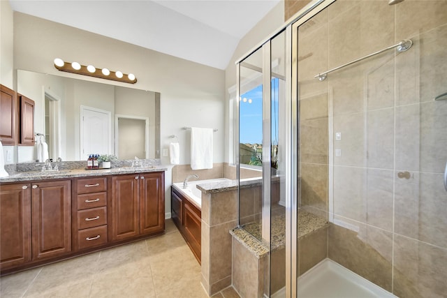 208 Harbor Bend Ln, Dickinson, TX 77539 - bathroom with a garden tub, a shower stall, double vanity, vaulted ceiling, and tile patterned floors