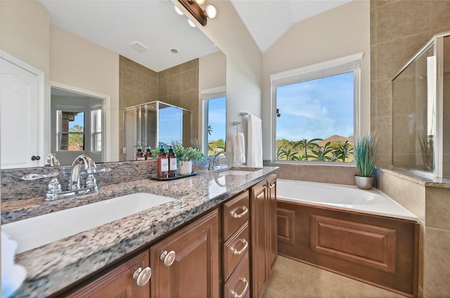 208 Harbor Bend Ln, Dickinson, TX 77539 - full bath featuring a stall shower, double vanity, a bath, lofted ceiling, and tile patterned flooring