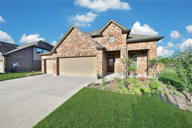 208 Harbor Bend Ln, Dickinson, TX 77539 - view of front facade with an attached garage, driveway, brick siding, and a front yard