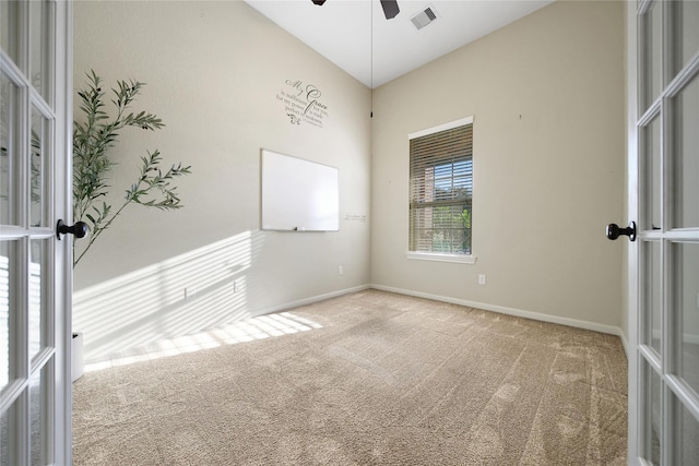 208 Harbor Bend Ln, Dickinson, TX 77539 - spare room featuring carpet, a ceiling fan, and french doors