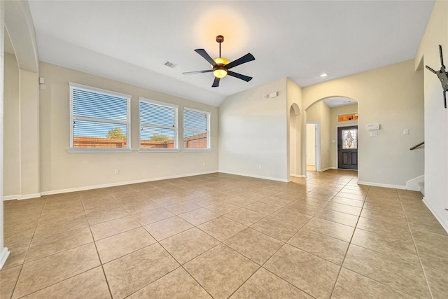 208 Harbor Bend Ln, Dickinson, TX 77539 - unfurnished room featuring light tile patterned floors, ceiling fan, arched walkways, stairway, and recessed lighting