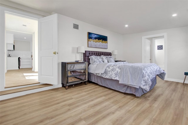 4716 Siegel St, Houston, TX 77009 - bedroom featuring light wood-type flooring and recessed lighting