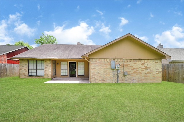 5518 Fair Forest Dr, Houston, TX 77088 - back of property with brick siding, a patio, and a shingled roof