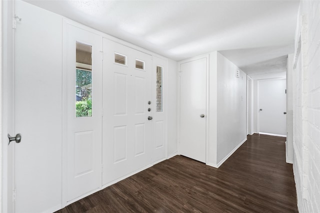 5518 Fair Forest Dr, Houston, TX 77088 - entryway featuring dark wood-type flooring and baseboards